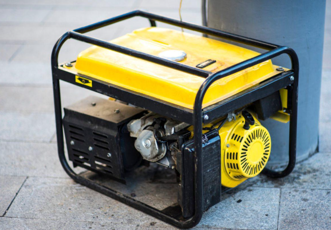 Portable generator transfer switch setup for a Tampa home, with a yellow portable generator ready for a hurricane power outage