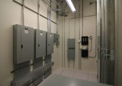 Electrical panel setup by Kazar’s Electric, featuring organized wiring systems and labels for safety.