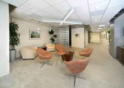 Modern seating area with chairs and tables at Kazar’s Electric, perfect for collaboration and relaxation.