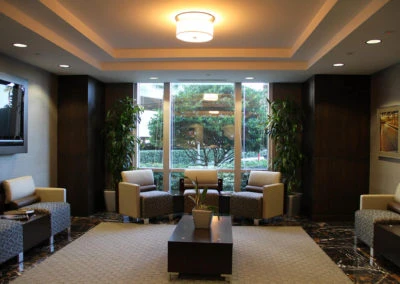 Contemporary seating area showcasing Kazar’s Electric's design, featuring armchairs, a sofa, and a coffee table.