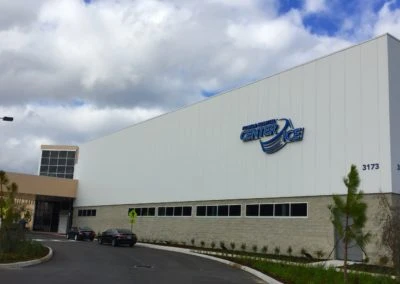 Modern building featuring Kazar’s Electric, Inc. with "CENTER" signage and well-maintained landscaping.