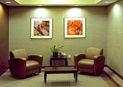 Cozy waiting area with leather armchairs and table, ideal for Kazar’s Electric client consultations.