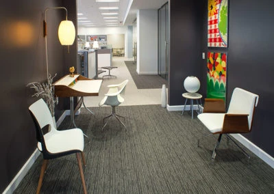 Modern office furniture with colorful artwork, reflecting Kazar's Electric's contemporary and professional style.