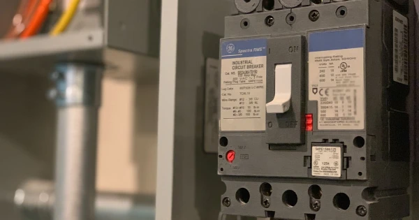 Industrial circuit breaker in electrical panel, illustrating essential components for backup generator safety and maintenance in Florida.