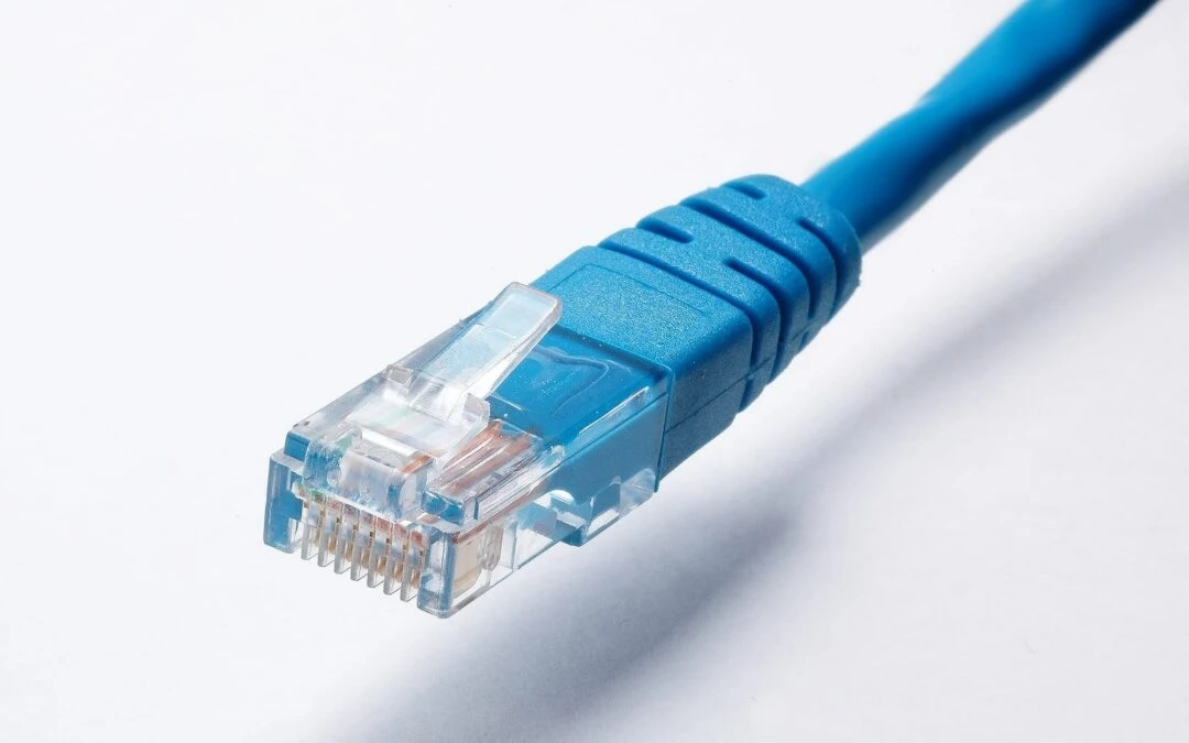 Blue Ethernet cable connector highlighting data connectivity essential for seamless communication and business operations.