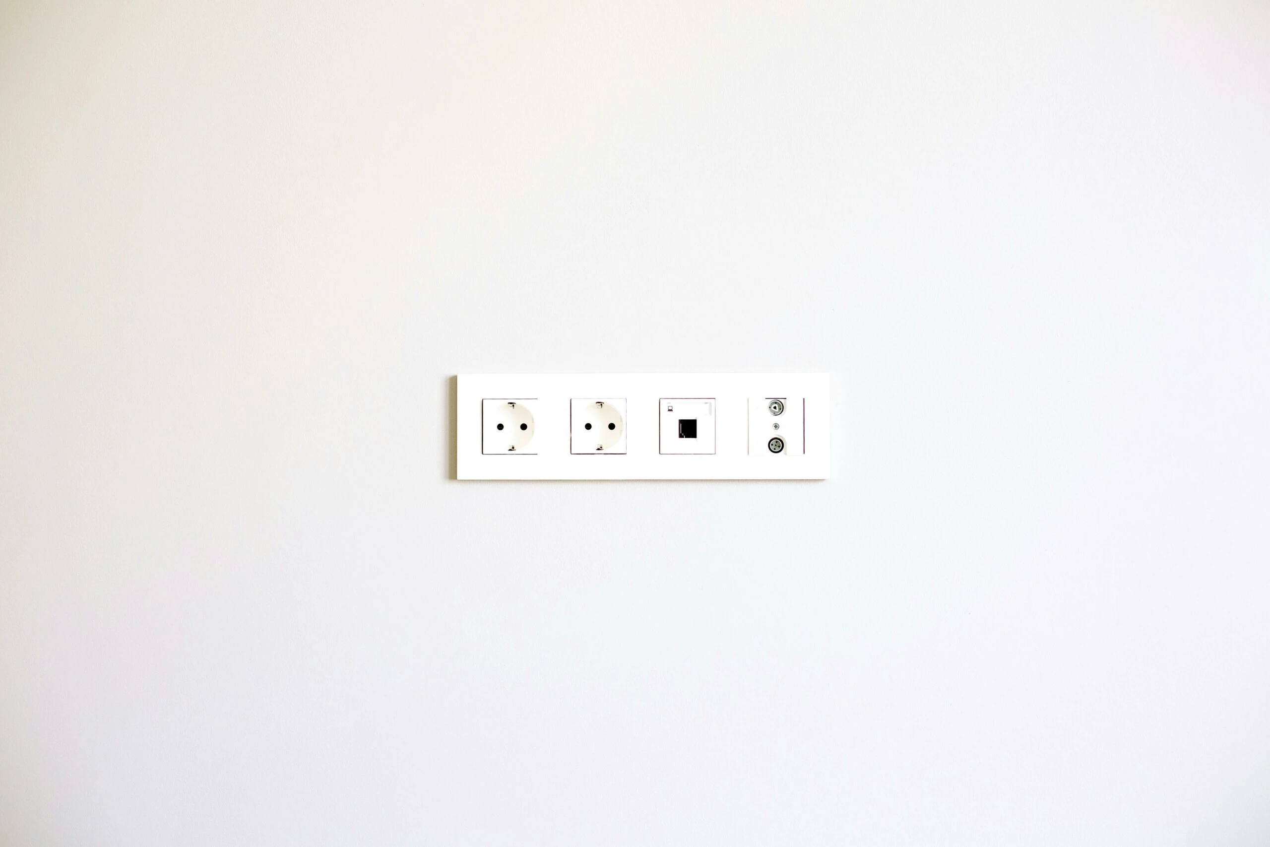 Wall-mounted electrical outlet panel with USB, showcasing modern design for Kazar's Electric services.