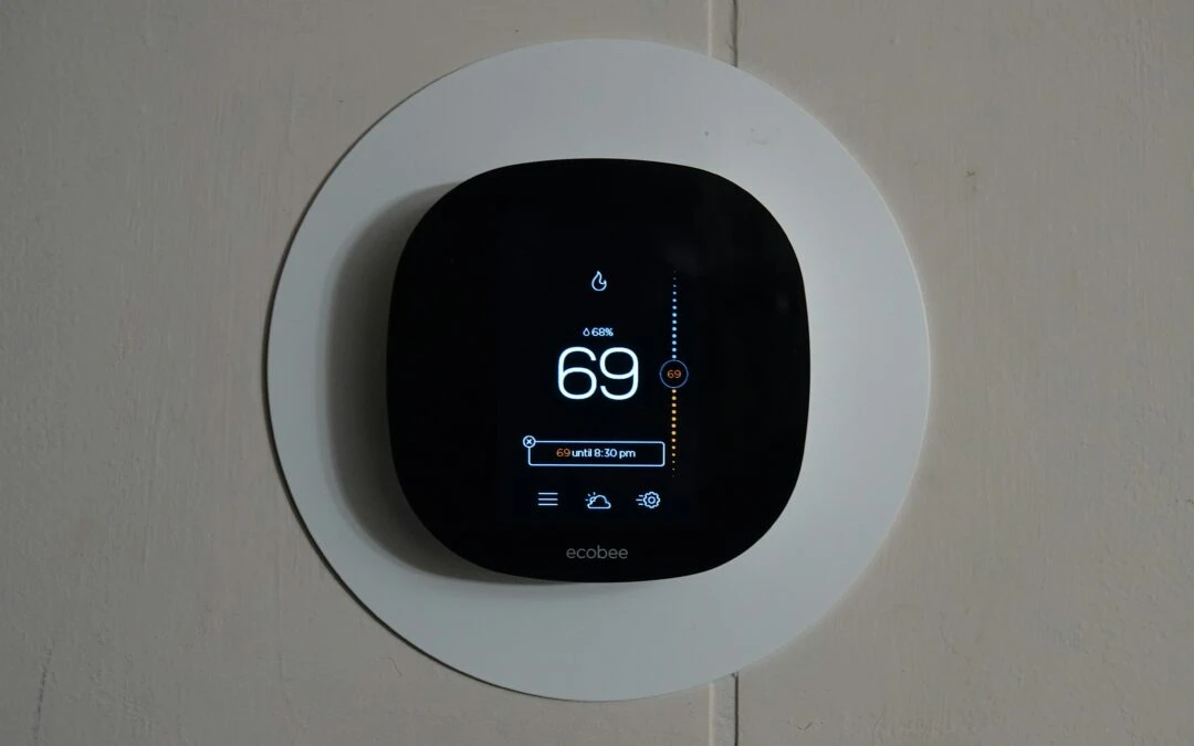 Ecobee Smart Thermostat with digital display and humidity indicator, enhancing home comfort by Kazar's Electric.